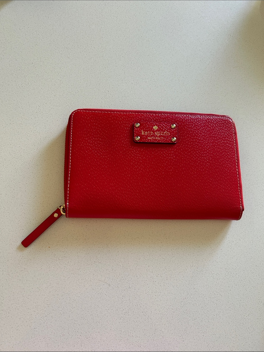 kate spade Red Zip-Around Pebbled Leather Wallet with Gold Hardware